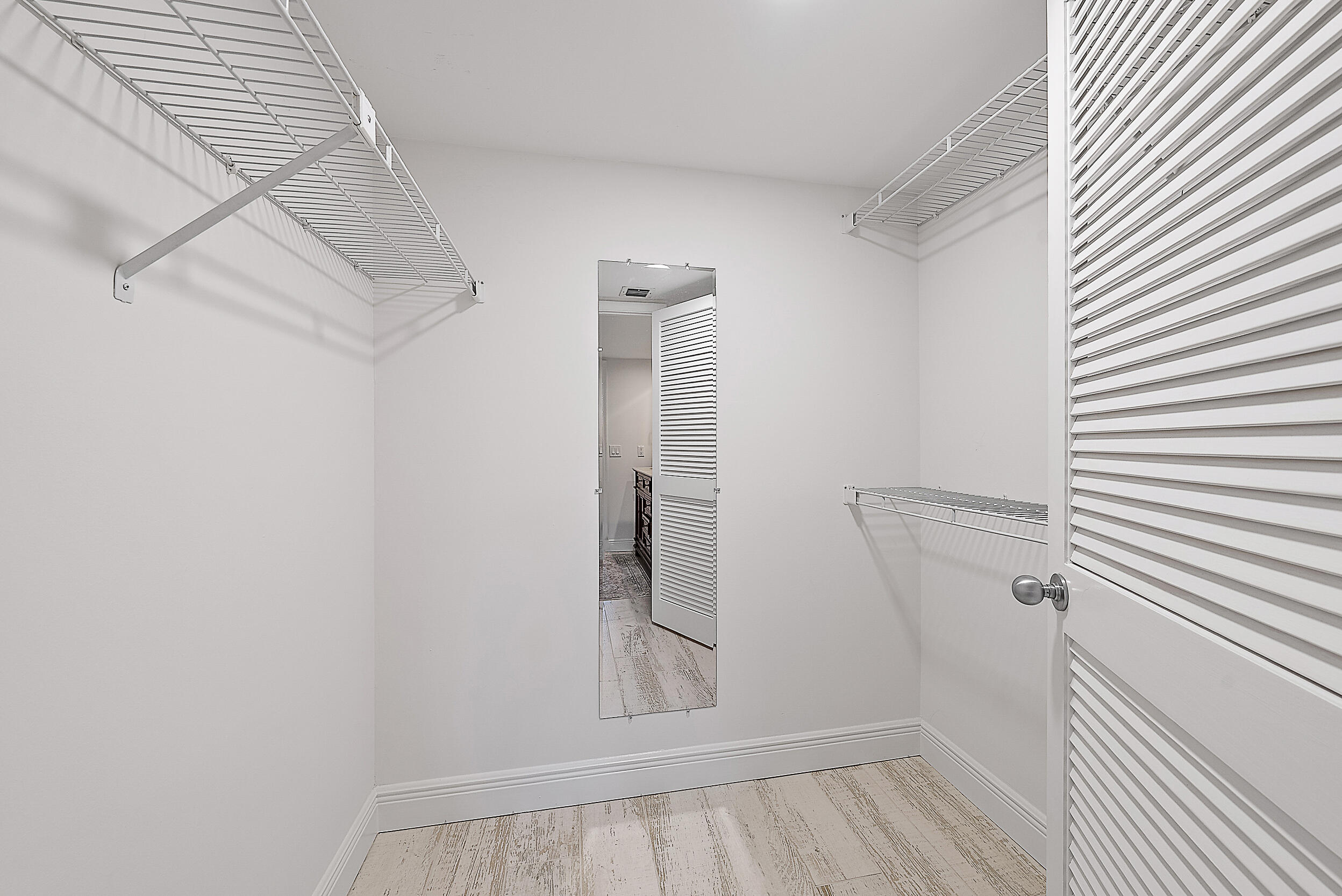 16647 Traders Crossing North, Unit 126 Jupiter, FL 33477 - Photo 23 of 45 a view of room with window and wooden floor