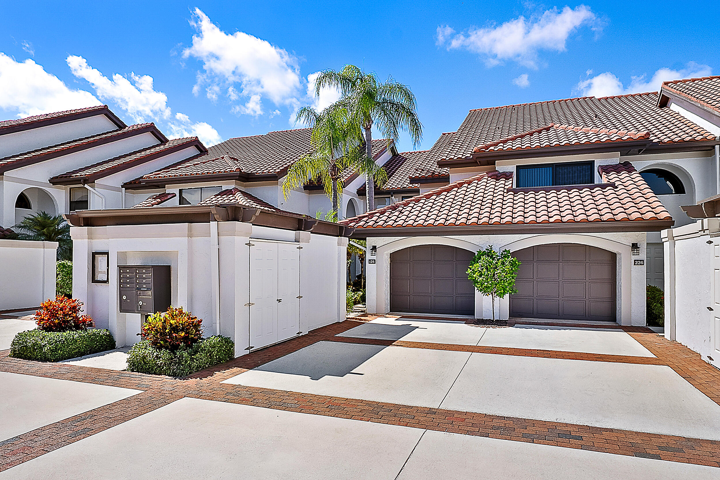 16647 Traders Crossing North, Unit 126 Jupiter, FL 33477 - Photo 32 of 45 a front view of a house with entryway