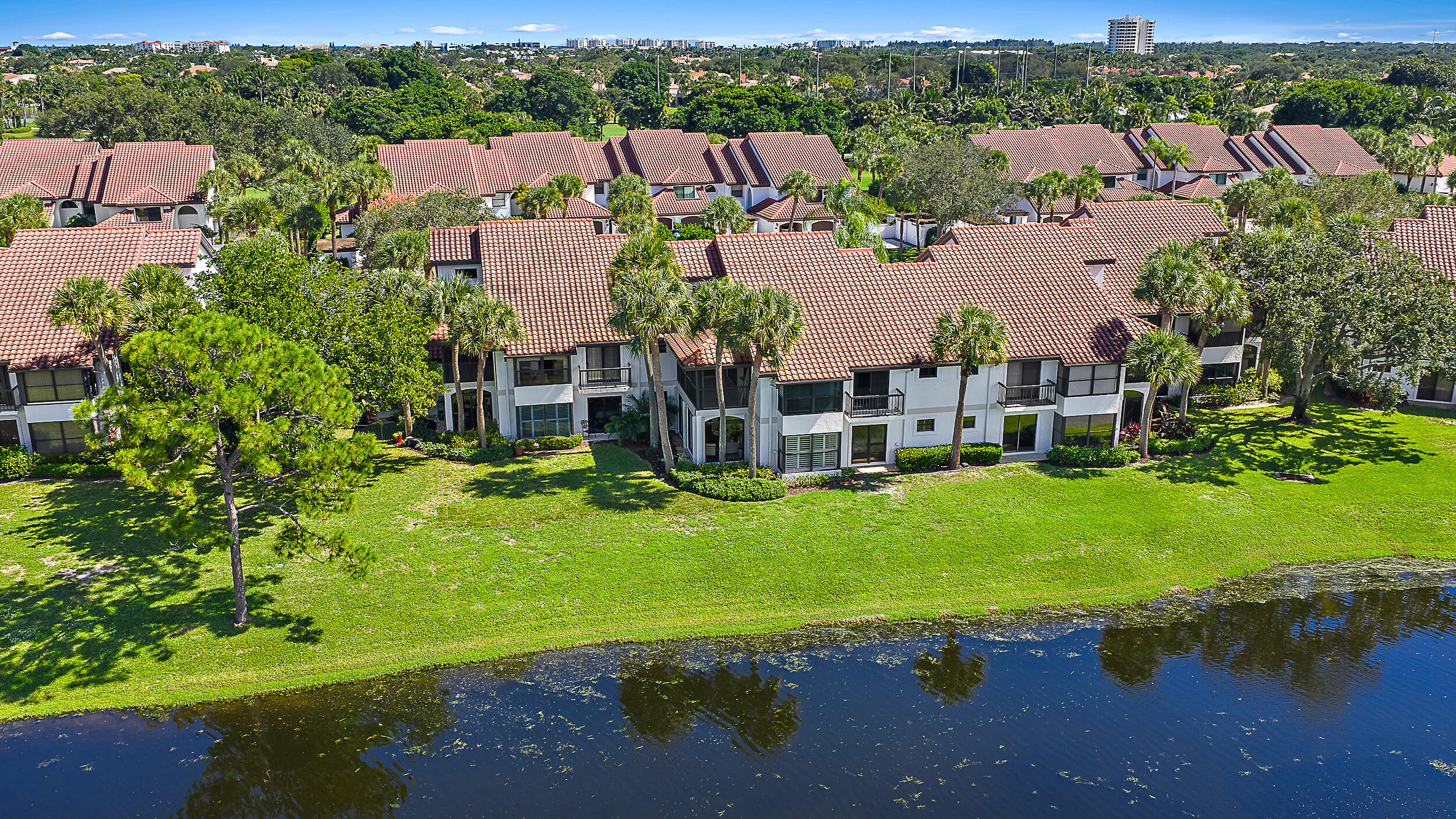 16647 Traders Crossing North, Unit 126 Jupiter, FL 33477 - Photo 34 of 45 an aerial view of residential houses with outdoor space and lake view