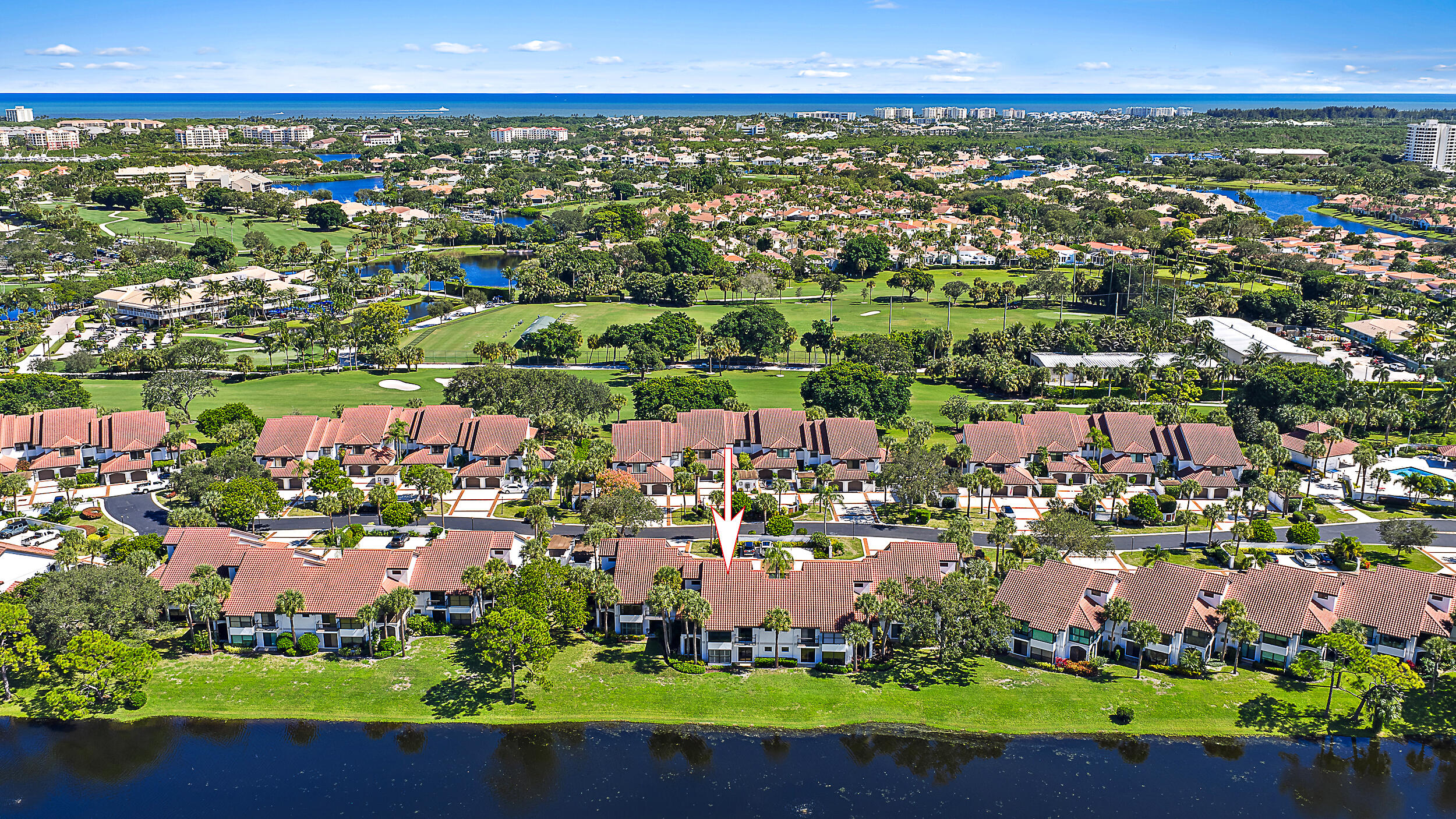 16647 Traders Crossing North, Unit 126 Jupiter, FL 33477 - Photo 4 of 45 an aerial view of a city with lots of residential buildings
