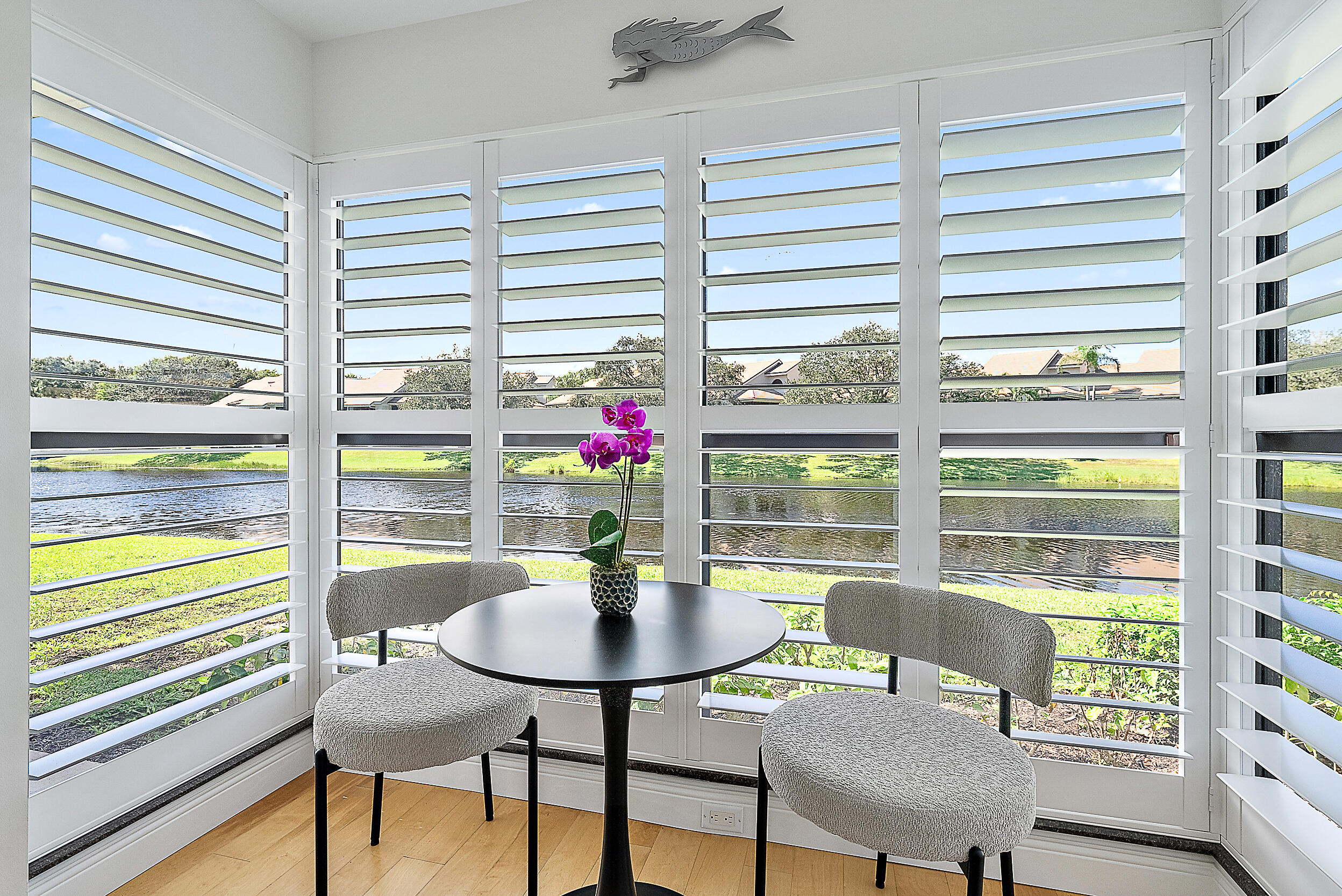 16647 Traders Crossing North, Unit 126 Jupiter, FL 33477 - Photo 5 of 45 a view of a dining room with furniture and a window