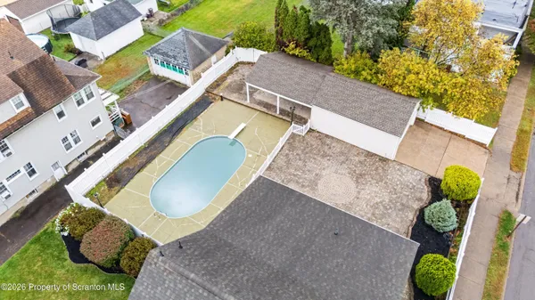 an aerial view of a house with outdoor space