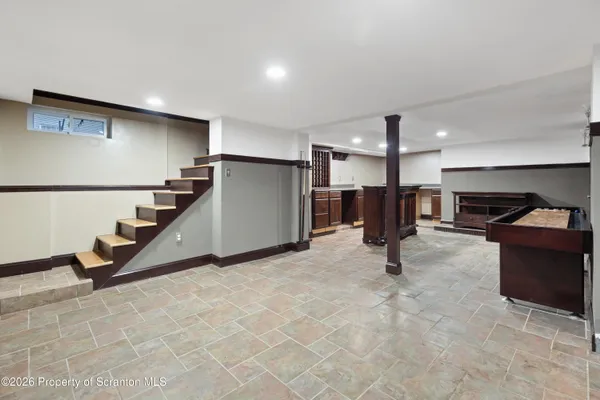 a kitchen with stainless steel appliances granite countertop a sink and a stove