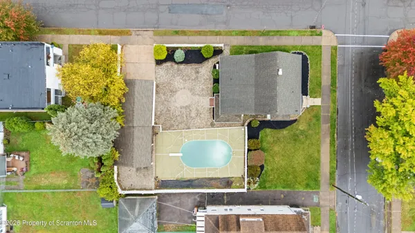 view of entryway with a small yard