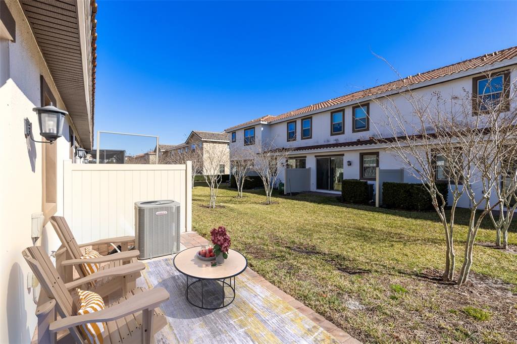 13969 Arclid Street Orlando, FL 32832 - Photo 16 of 29 a front view of a house with garden
