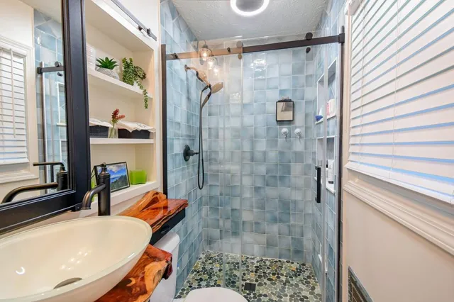 a bathroom with a tub and a shower