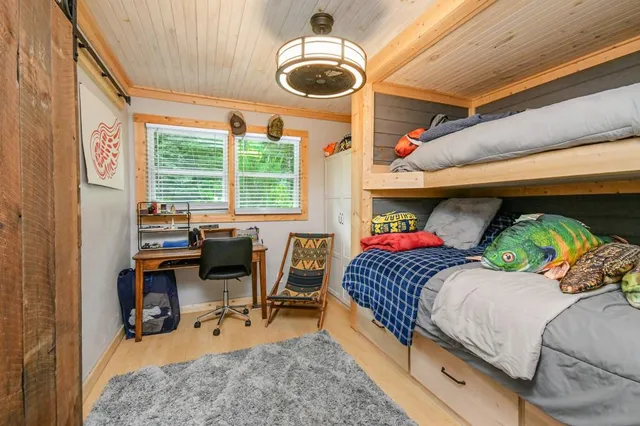 a bedroom with furniture and a window