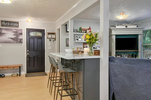a dining room with furniture and window