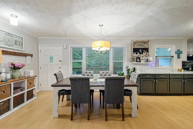 a view of a dining room with furniture window and outside view