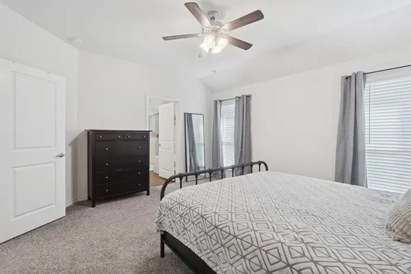a bedroom with a bed and a closet