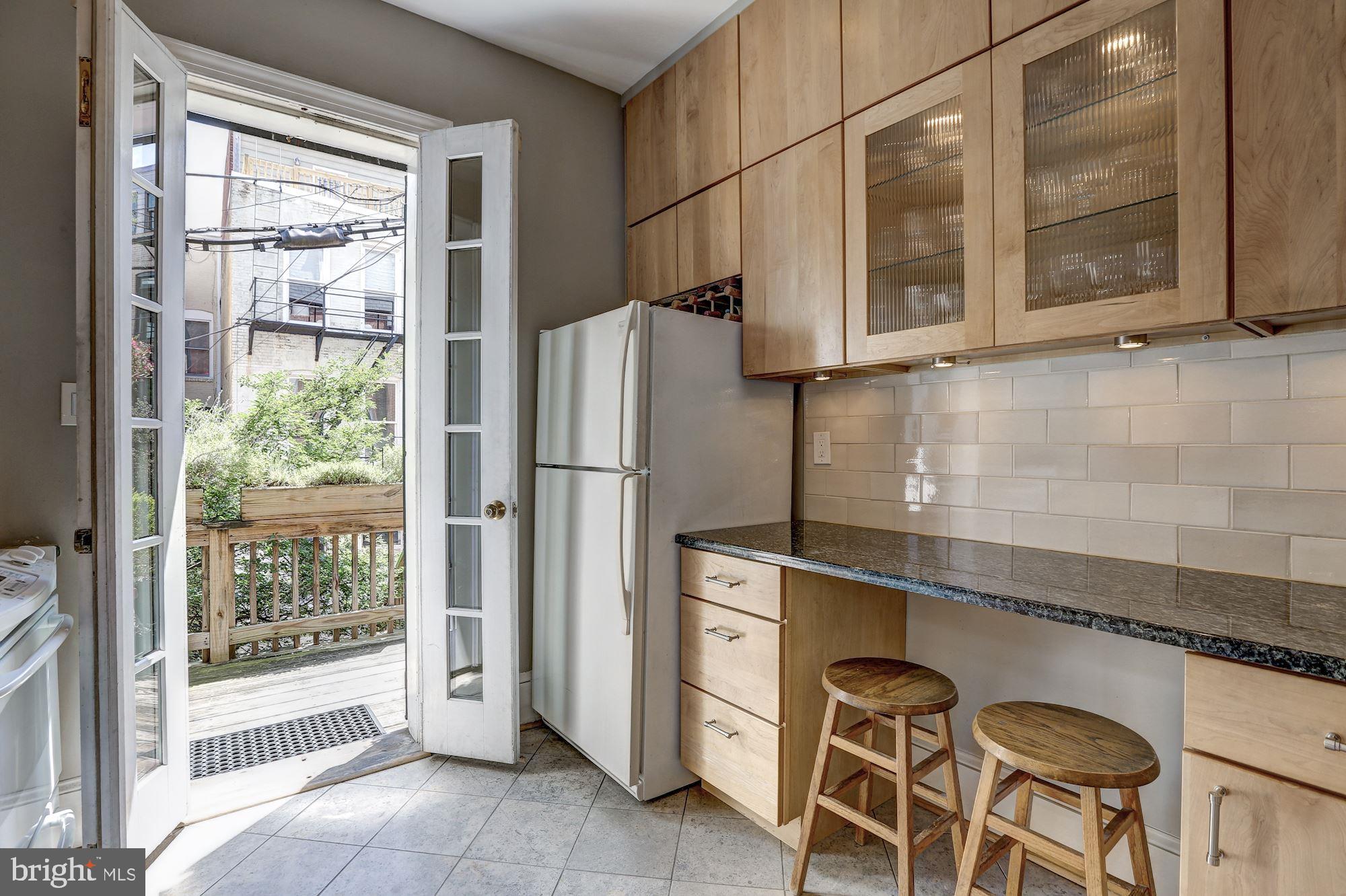 2110 Bancroft Place Northwest Washington, DC 20008 - Photo 20 of 27 Kitchen with French doors to deck
