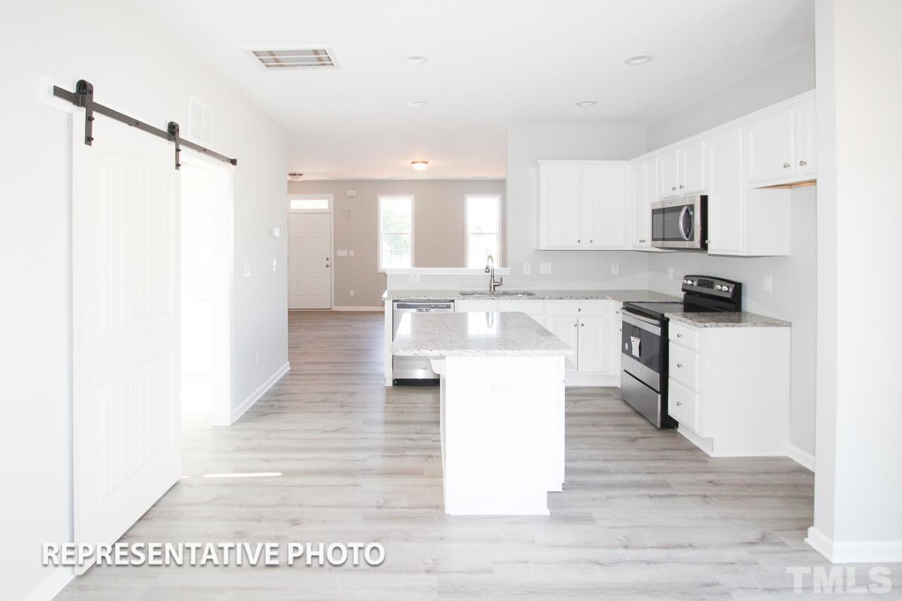 345 Longbow Drive Middlesex, NC 27557 - Photo 3 of 9 a large kitchen with cabinets