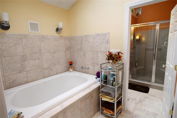 5 Acre Road Billerica, MA 01821 - Photo 13 of 30 a bathroom with a tub and a shower