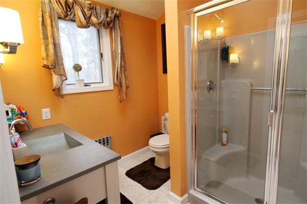 5 Acre Road Billerica, MA 01821 - Photo 14 of 30 a bathroom with a sink and a mirror