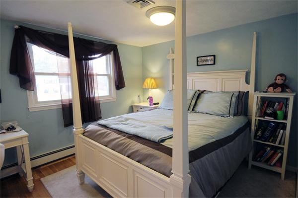 5 Acre Road Billerica, MA 01821 - Photo 16 of 30 a bed sitting in a bedroom next to a window