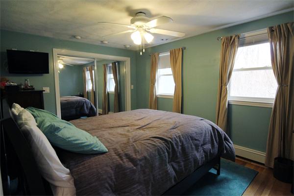 5 Acre Road Billerica, MA 01821 - Photo 18 of 30 a bedroom with a bed lamps and a large mirror
