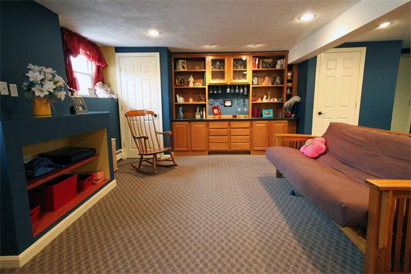 5 Acre Road Billerica, MA 01821 - Photo 19 of 30 a bedroom with furniture and a flat screen tv