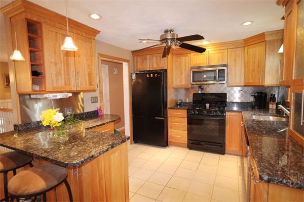 5 Acre Road Billerica, MA 01821 - Photo 2 of 30 a kitchen with a refrigerator and a sink