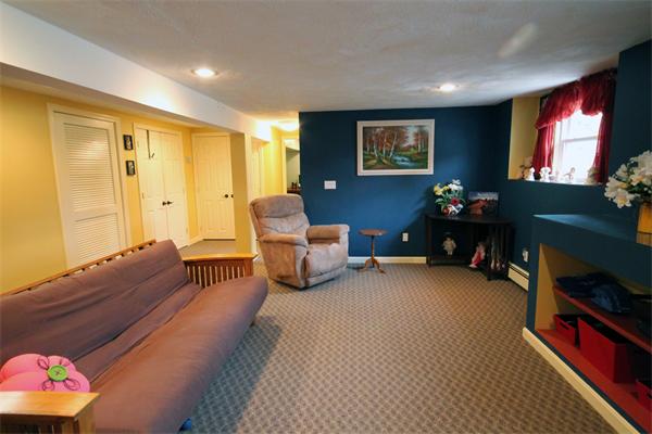 5 Acre Road Billerica, MA 01821 - Photo 21 of 30 a living room with furniture gym equipment and a window
