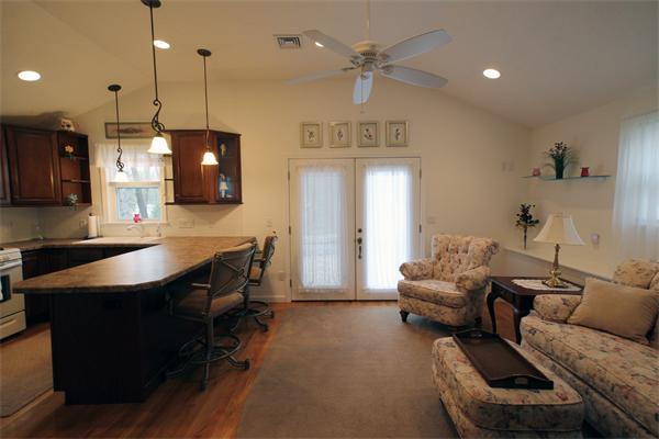 5 Acre Road Billerica, MA 01821 - Photo 24 of 30 a living room with furniture a ceiling fan and a flat screen tv
