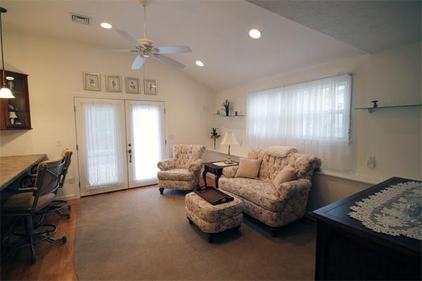5 Acre Road Billerica, MA 01821 - Photo 25 of 30 a living room with furniture and a chandelier