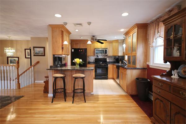 5 Acre Road Billerica, MA 01821 - Photo 3 of 30 a large kitchen with lots of counter space and stainless steel appliances