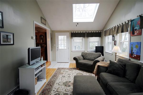 5 Acre Road Billerica, MA 01821 - Photo 9 of 30 a living room with furniture a flat screen tv and a window