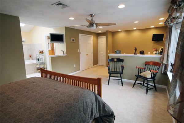 5 Acre Road Billerica, MA 01821 - Photo 10 of 30 a spacious bedroom with a bed and a desk in it