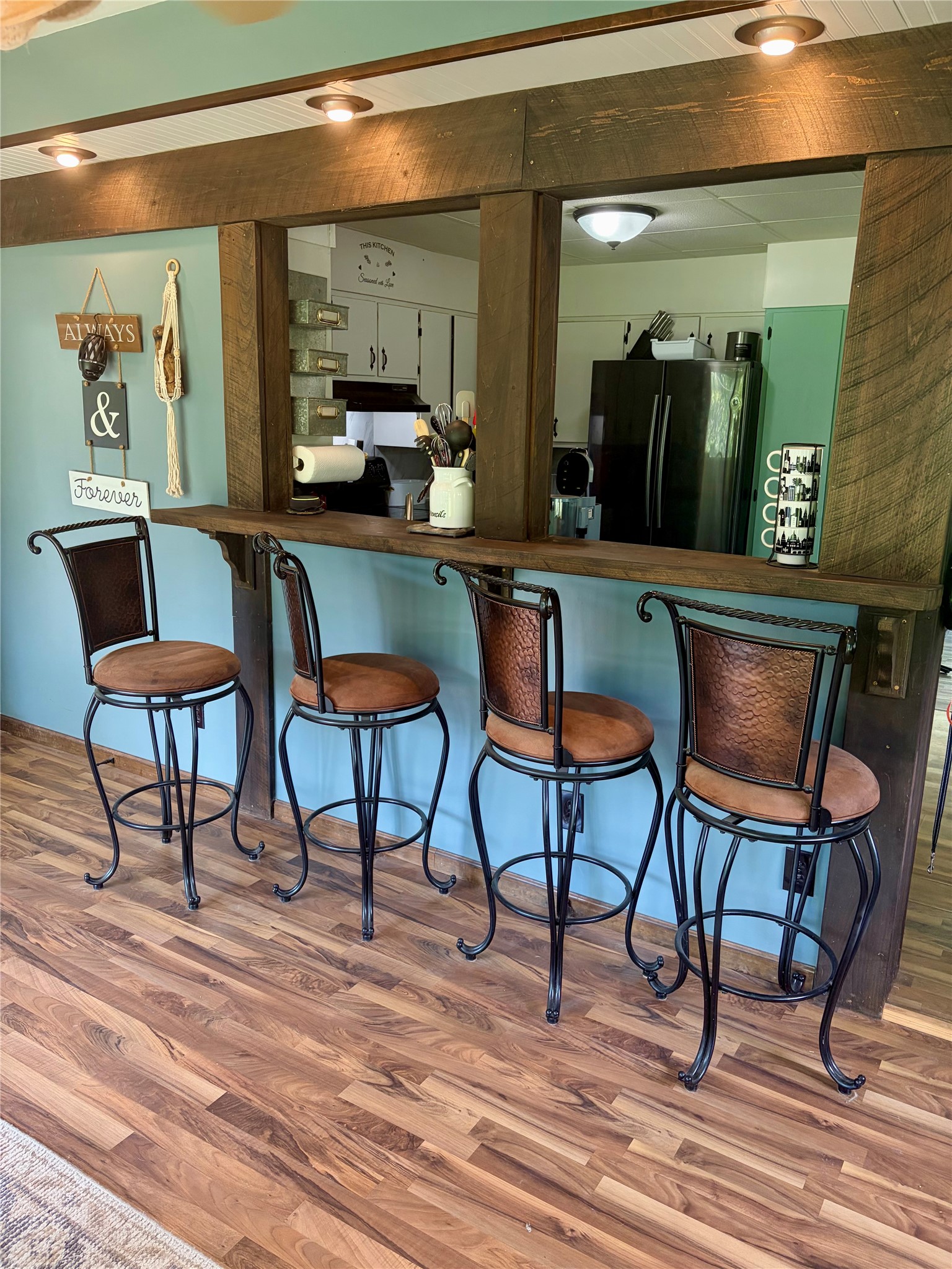 1490 Carlton Road Carlton, PA 16311 - Photo 25 of 44 4 stools between kitchen and dining room