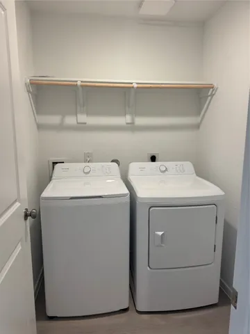 a utility room with dryer and washer