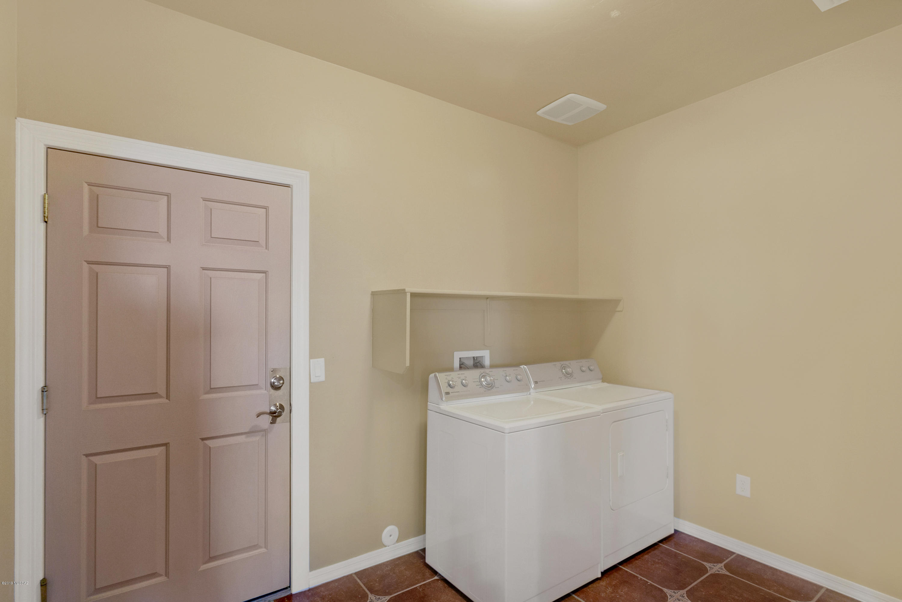 21960 South Helvetia Road Sahuarita, AZ 85629 - Photo 22 of 29 a utility room with dryer and washer