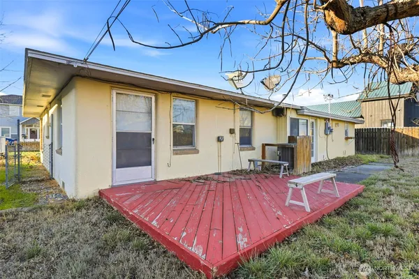 a view of a backyard with sitting area