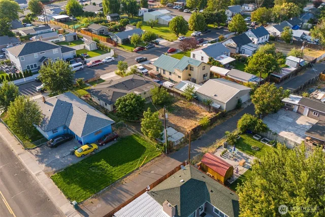 an aerial view of residential house with outdoor space and swimming pool