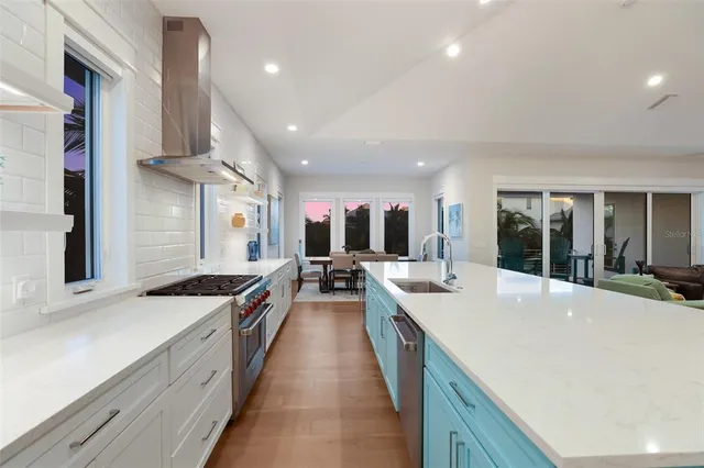 a en suite bathroom with a double vanity sink a mirror and a bathtub