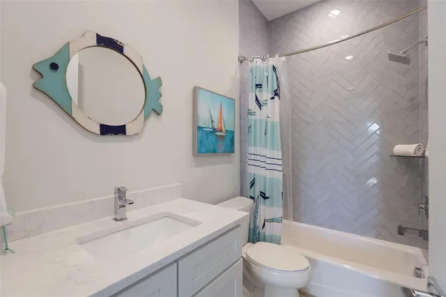 a view of swimming pool with lounge chair and trees in the background
