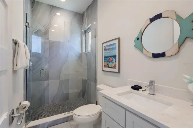 a view of a house with pool and sitting area