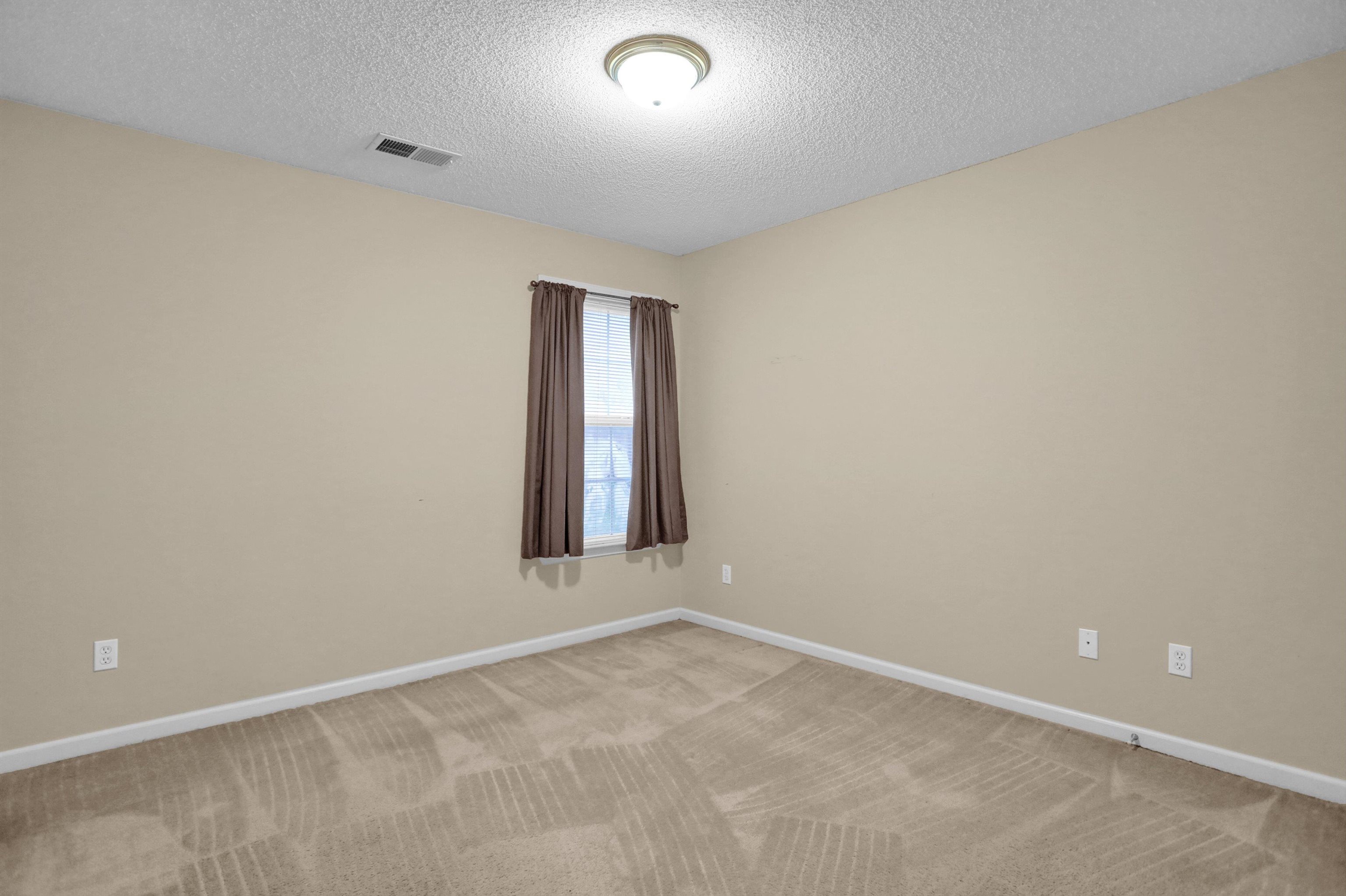 2159 Purple Leaf Lane Memphis, TN 38016 - Photo 12 of 14 an empty room with a window