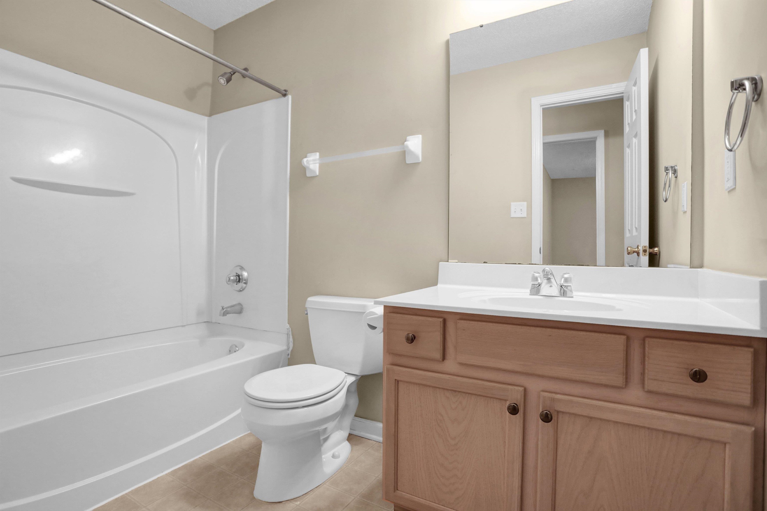 2159 Purple Leaf Lane Memphis, TN 38016 - Photo 13 of 14 a bathroom with a sink a toilet and a mirror