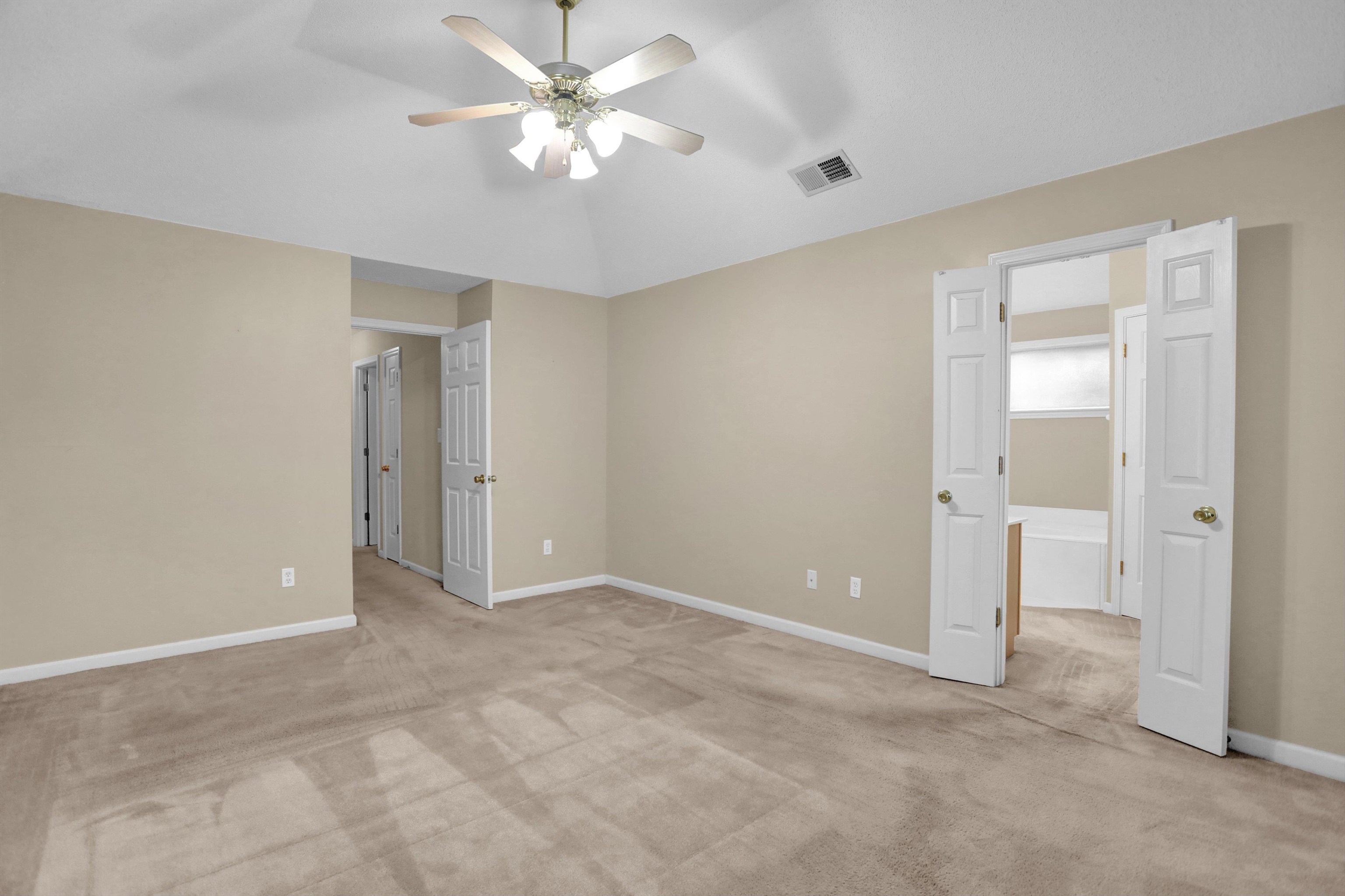 2159 Purple Leaf Lane Memphis, TN 38016 - Photo 8 of 14 a view of an empty room with a ceiling fan