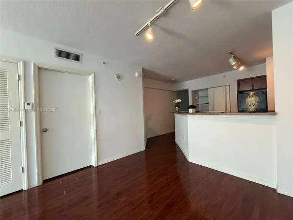 a view of a kitchen with a sink and a microwave