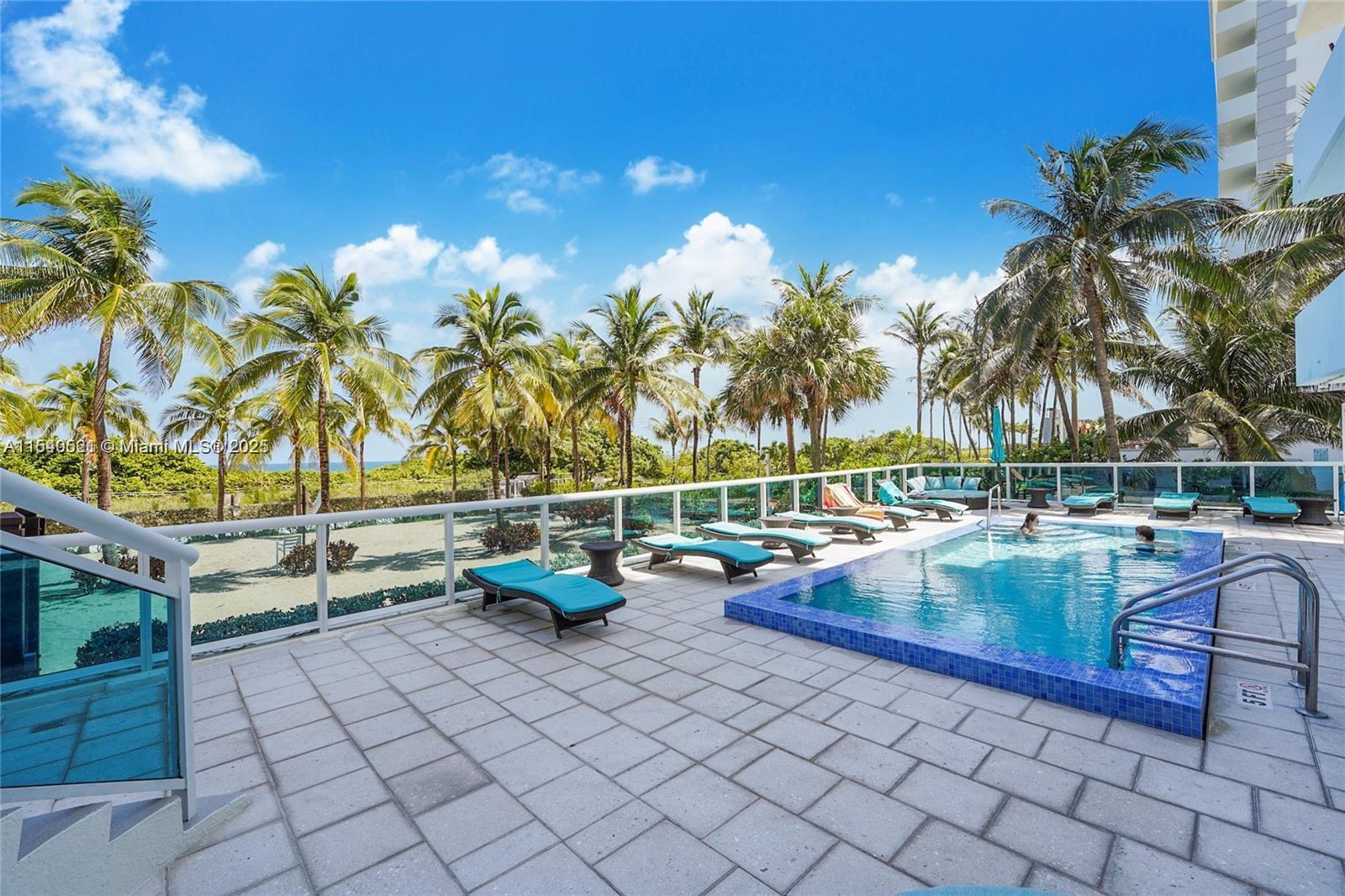 9201 Collins Avenue, Unit 1023 Surfside, FL 33154 - Photo 20 of 28 swimming view of swimming pool with outdoor seating