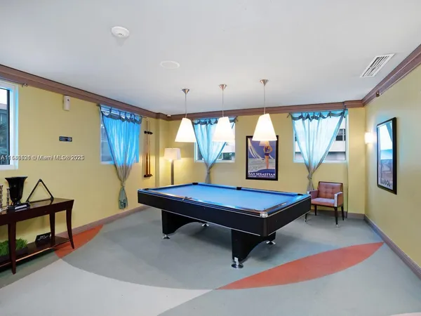 a room with lots of furniture and windows
