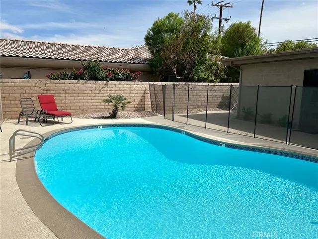 a view of a swimming pool with a lake