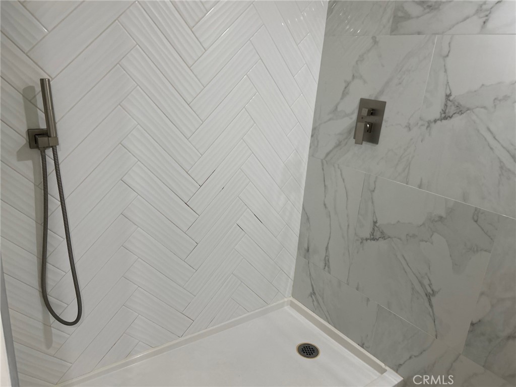 74443 Driftwood Drive, Unit 2 Palm Desert, CA 92260 - Photo 14 of 19 a bathroom with a shower