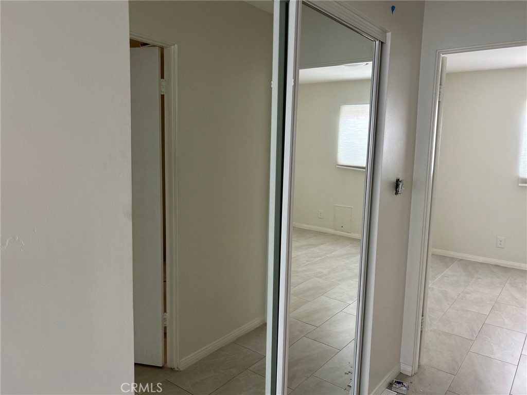 74443 Driftwood Drive, Unit 2 Palm Desert, CA 92260 - Photo 16 of 19 a bathroom with a glass shower door