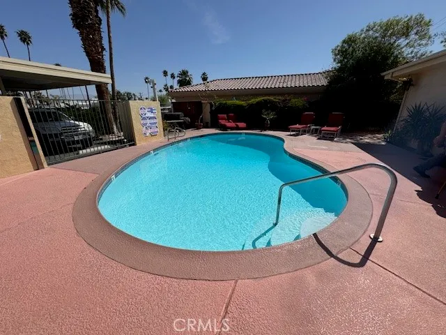 a view of a swimming pool with a patio