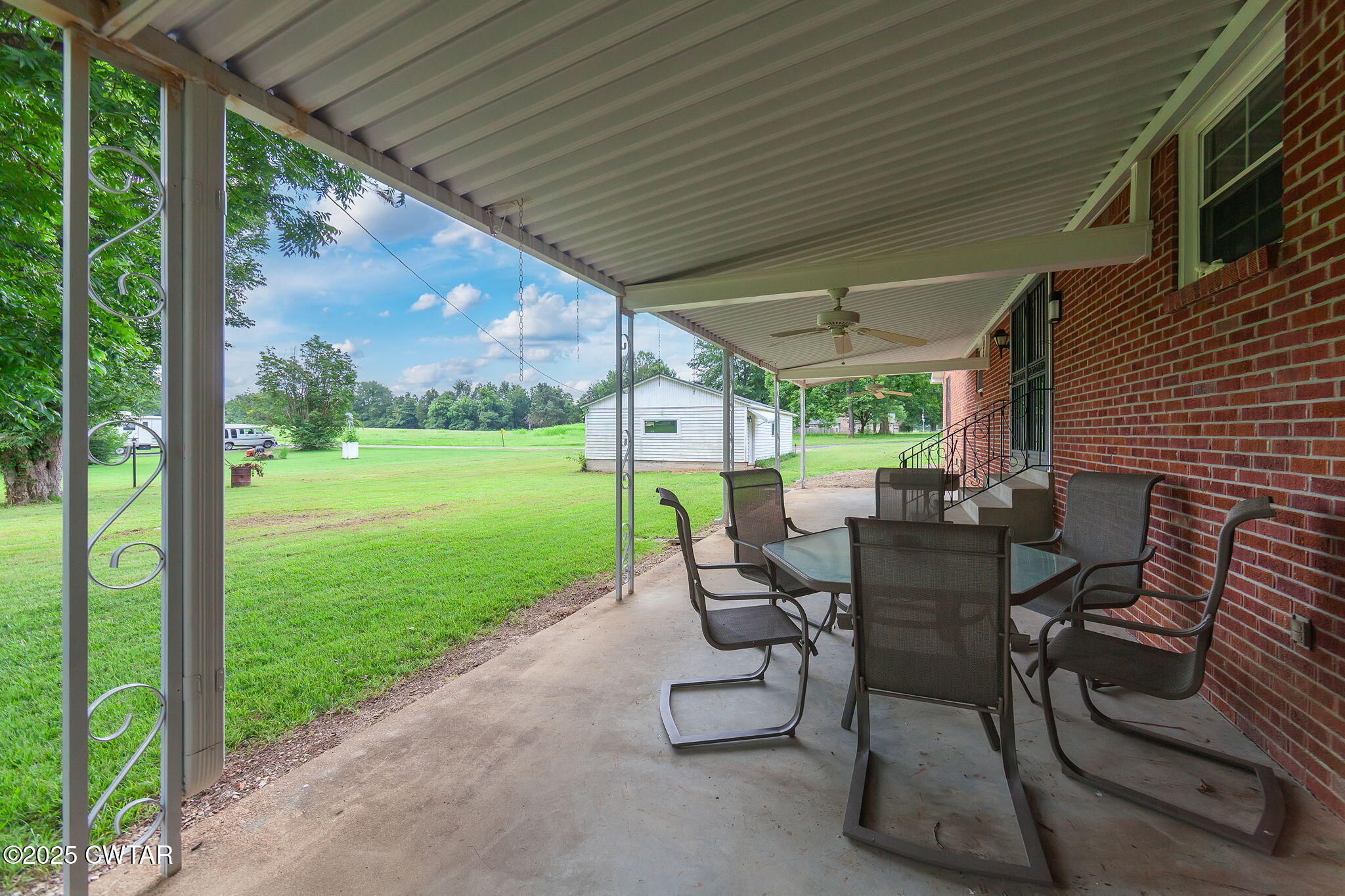 228 Gobelet Road Medon, TN 38356 - Photo 19 of 23 a view of a patio with a table chairs and backyard