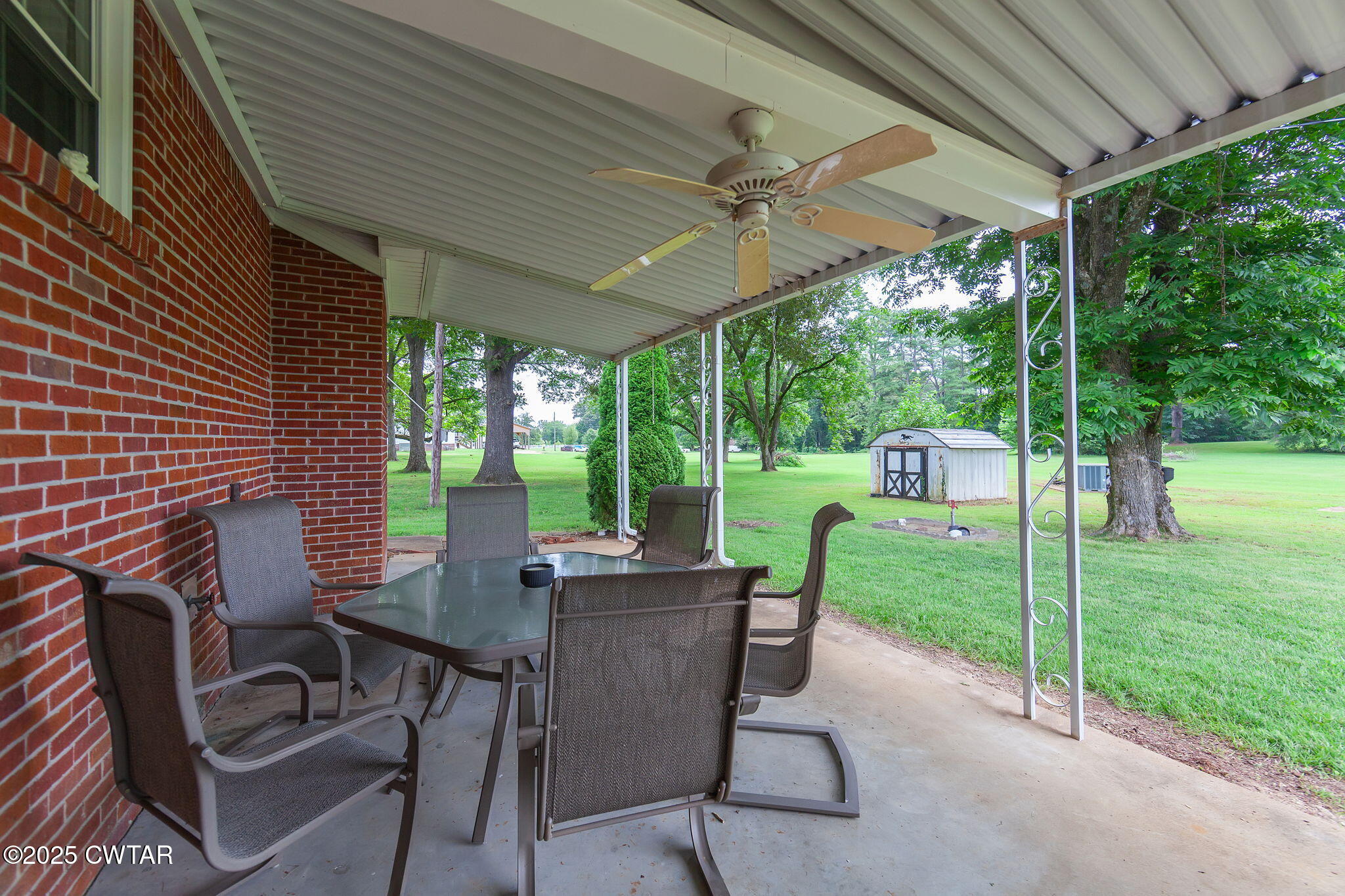 228 Gobelet Road Medon, TN 38356 - Photo 20 of 23 a view of a patio with a table chairs and backyard