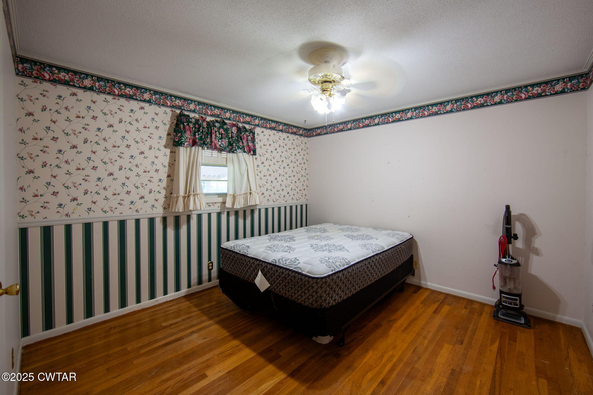 228 Gobelet Road Medon, TN 38356 - Photo 9 of 23 a bedroom with bed and wooden floor
