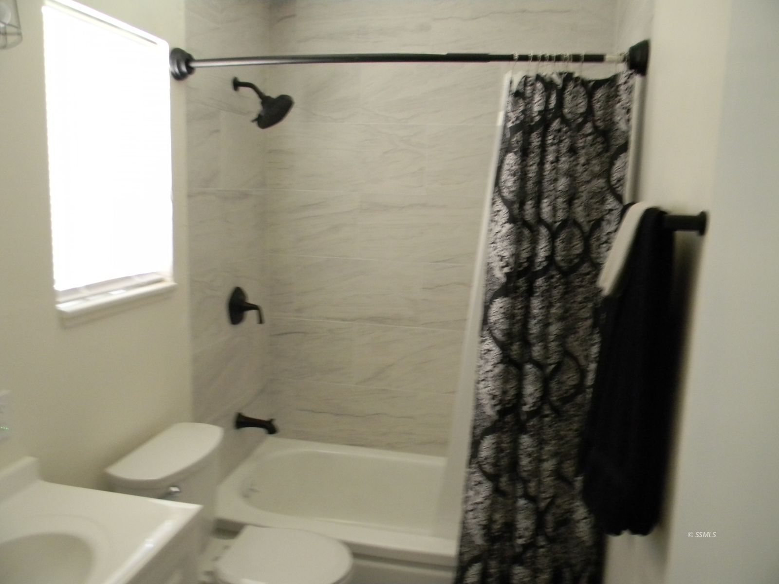 240 West Perdew Avenue Ridgecrest, CA 93555 - Photo 7 of 12 a bathroom with a bathtub and shower